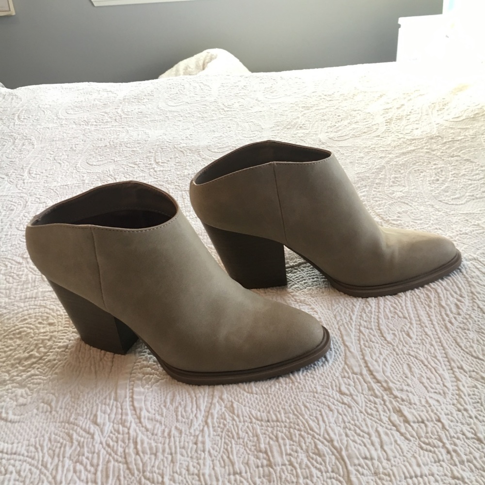 Tan high-heel booties.